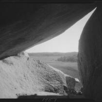 View from under rock formation or inside cave, Riverside County, [1920-1939?]
