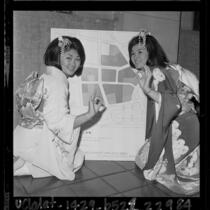 Two Japanese American woman in kimonos giving  