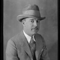 Portrait of Darrel B. Foss, in suit, tie, and hat, 1924