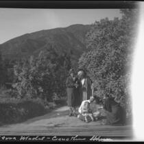 Ralph D. Cornell family gathered in front of Blueblossom bushes, Sierra Madre, 1932