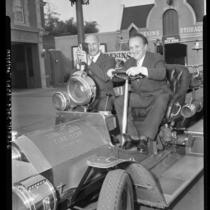 Sergei Gerasimov and Playwright Georgrii Mdivani tour Disneyland in fire engine, 1958