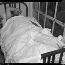 Wrestler Man Mountain Dean in bed with a broken leg, Los Angeles, 1937