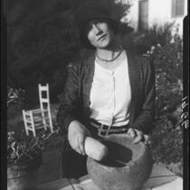 Woman with grinding stone and pestle, Palos Verdes Estates, 1930 or 1931