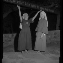 Bishop Nekona tells Sister Muriel of the fire that enveloped the Fountain of the World headquarters, 1958.