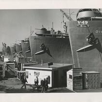 Ship workers working next to docked ships, San Pedro Harbor