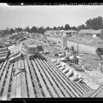 Workmen shingling roofs on new tract of three bedroom houses in Van Nuys, Calif., 1948