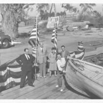Lifeboat: Alfred and Alma Hitchcock, MacGowan, John Steinbeck watch Tallulah Bankhead christen lifeboat