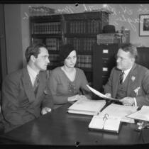 Actor Fredric March, Mrs. Carol Gallagher, and Judge Lewis H. Smith discussing bond to release property of actress Mary Astor, 1932