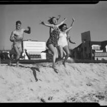 Young people jumping on beach, Santa Monica, 1938