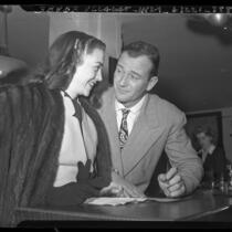 Actors John Wayne and Esperanza Baur applying for marriage license in Los Angeles, Calif., 1946