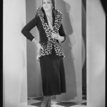 Peggy Hamilton modeling a suit of brown velvet velour, 1930