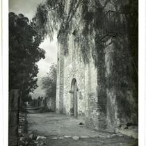 Mission San Gabriel Arcangel, view towards east facade and cemetery wall, San Gabriel, circa 1900