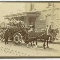 Horse drawn carriage carrying police officers outside William Brothers Grocery, Los Angeles