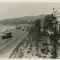 A bus and other vehicles driving on the Pacific Coast Highway