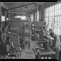 Workers creating chairs and tables in the Roberti Brothers' furniture factory, Los Angeles, circa 1920-1930