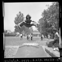 Children playing on a trampoline at UCLA elementary school, 1970