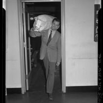 Actor Henry Fonda with seabag on shoulder after enlisting in United States Navy, 1942